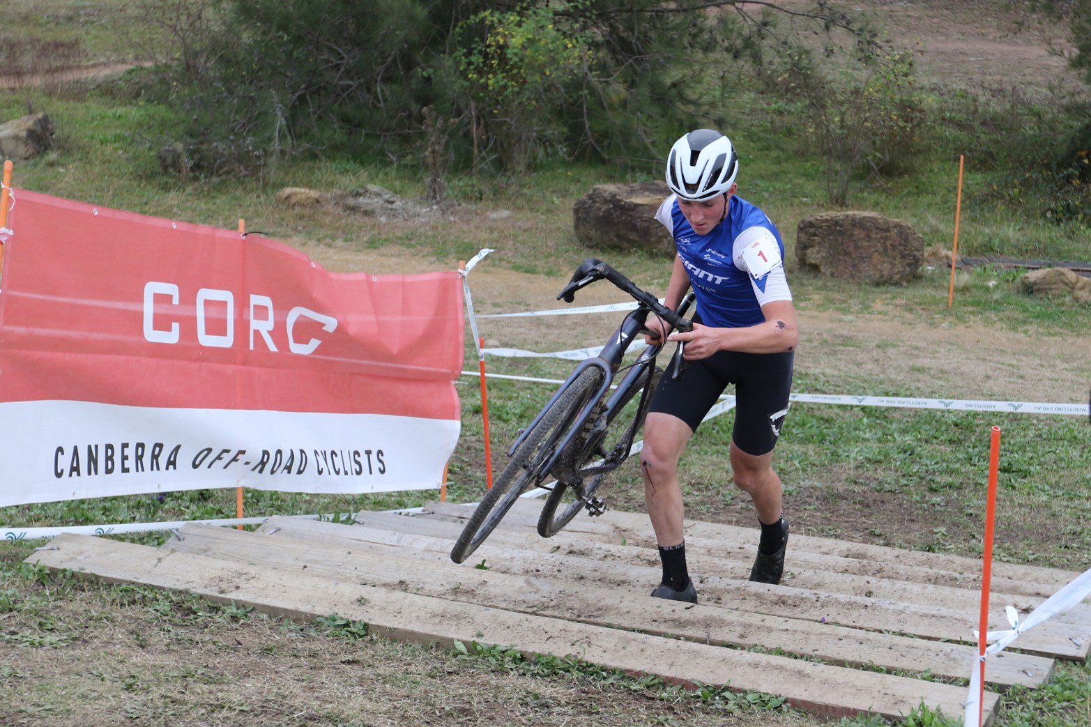 Hayden Vimpani runs up the stairs in Round 3 of the AusCycling Cyclo-cross National Series in Canberra